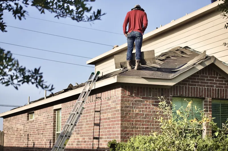 Professional roofer working on a residential roof in NoHo Arts District